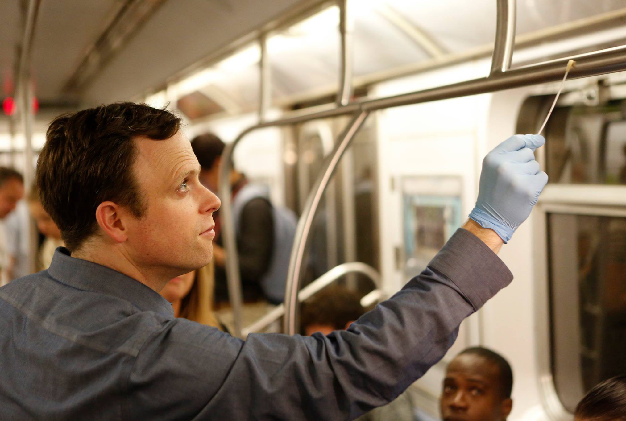 Chris Mason samples a New York City subway car for DNA, RNA and microbes on Global City Sampling Day