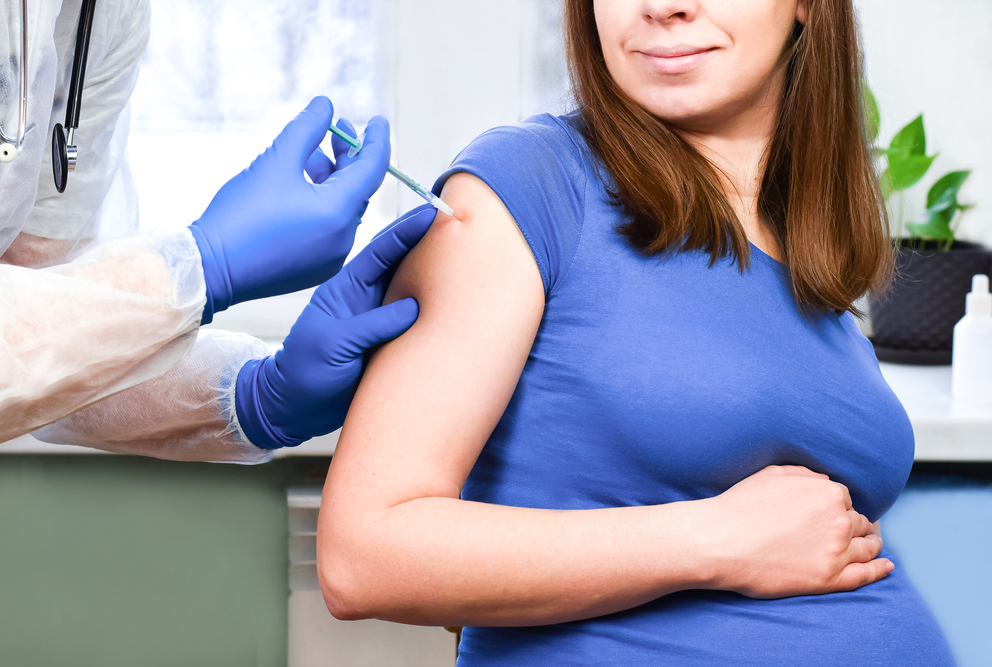image of a pregnant woman getting a vaccine