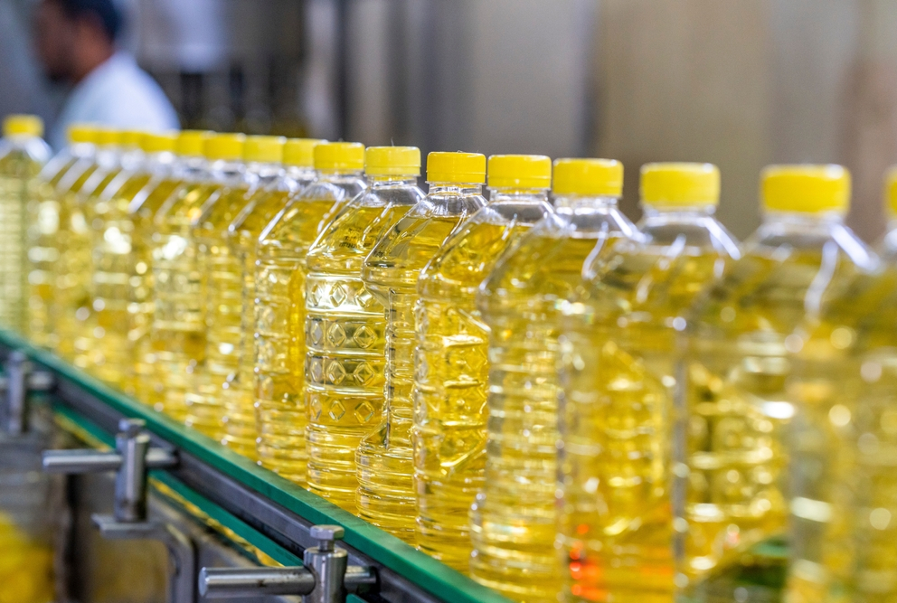 line of vegetable oils in industrial setting