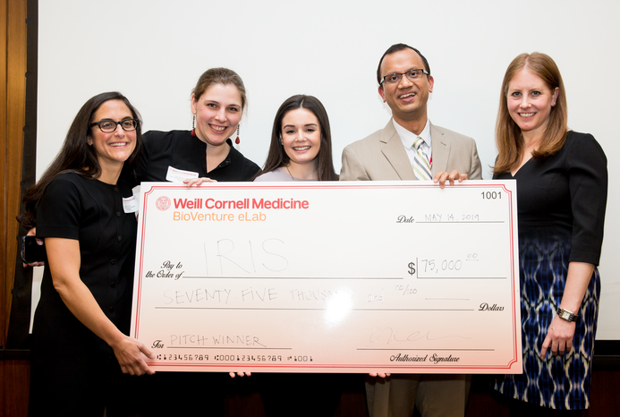 The company Iris takes first prize in the $100,000 Biomedical Business Plan Challenge. Team members from left to right: Drs. Rochelle Joly, Alison Herman, Meghan Reading Turchioe, Jyotishman Pathak, and graduate student Andrea Cohen. [Not pictured:Dr. Yiye Zhang]. All photos: Ashley Jones.