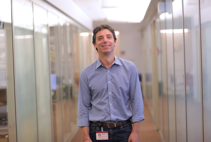a man in a lab posing for a picture
