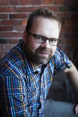 A man posing for a photo