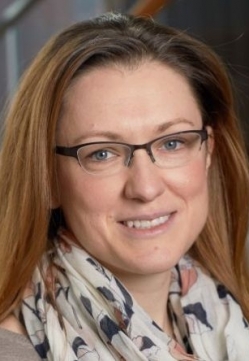 a woman smiling for a portrait