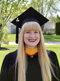 a woman smiling for a portrait
