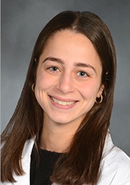 a woman smiling for a portrait