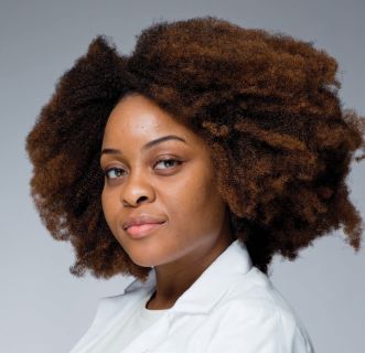 a woman smiling for a portrait