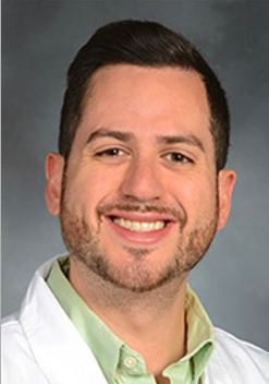 A man posing for a photo