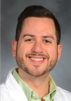 A man posing for a photo