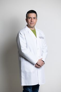 a man in a white coat