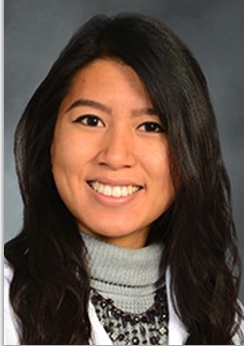 a woman smiling for a portrait
