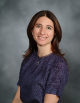 a woman smiling for a portrait