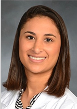 a woman smiling for a portrait
