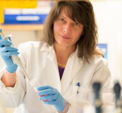 woman in a lab holding  test tube