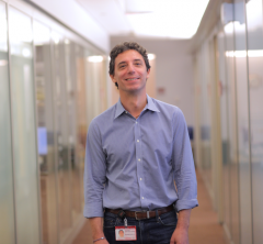 a man in a lab posing for a picture